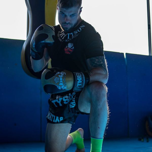 Focused man in a calm state preparing for a workout session.